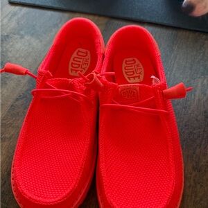 Hey Dude women’s neon orange Slip-On Sneakers